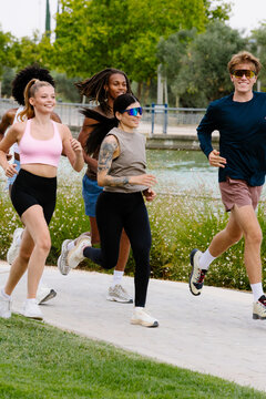 Local community enjoying an outdoor workout in a sunny nature park.