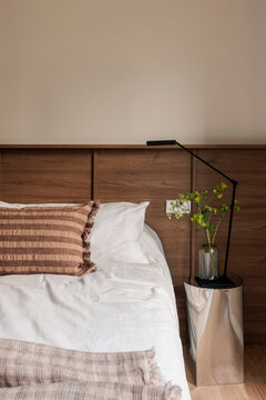 Chrome nightstand with vase and lamp