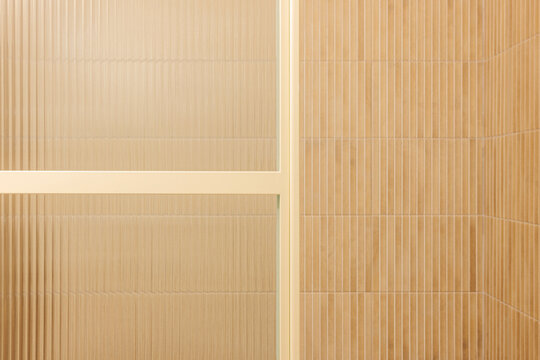 Vertical beige bathroom tiles detail