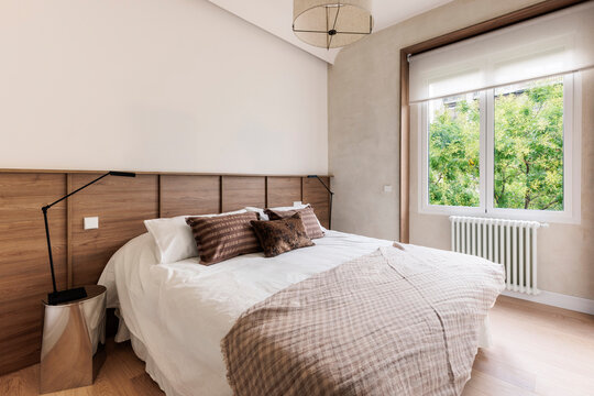 Master bedroom with view of trees