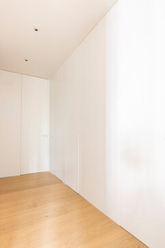 Floor to ceiling white closet hallway