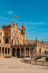 Grand facade of Plaza de Espana with Spanish flag © Puripat