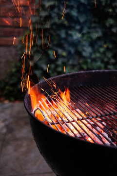 Charcoal Grill With Flames and Sparks