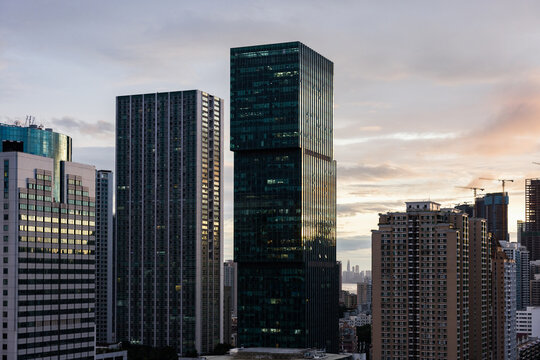 Modern Buildings Rise Above the City Skyline During Sunset