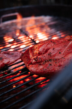 Seasoned Meat Over Glowing Coals