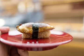 A grilled foie gras nigiri. Close up © Dontree