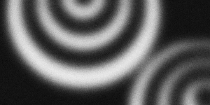 Soft blurred monochromatic background featuring large concentric circles and grain texture, creating a smooth optical wave and ripple effect.