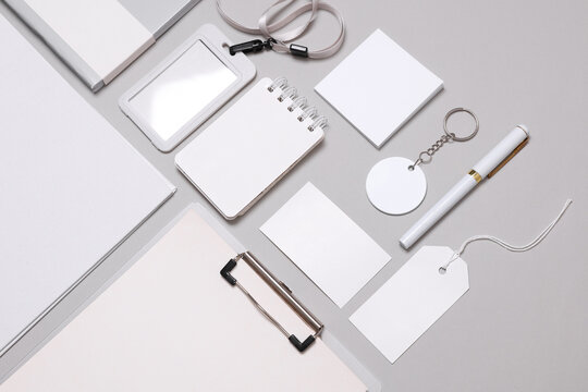 Corporate identity, set of white blank promotional products for business on a gray background. Flat lay. Creative mockup for your brand design.