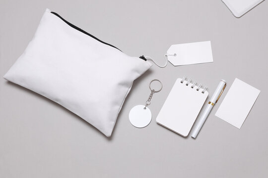 Corporate identity, set of white blank promotional products for business on a gray background. Flat lay. Creative mockup for your brand design.