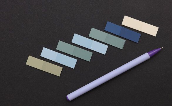 Set of colored paper stickers on black background. Business concept.