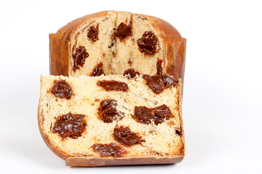 Sliced Christmas panettone filled with creamy chocolate, isolated on a white background for a festive celebration.