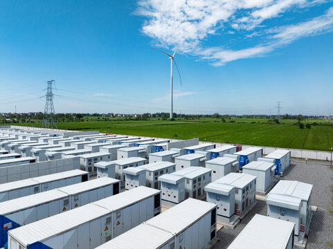energy storage station and wind turbine under blue sky
