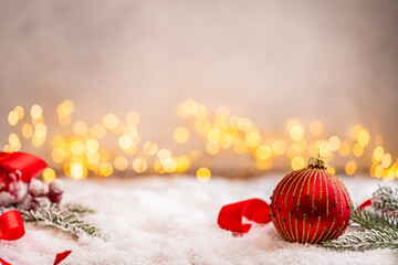 Naklejka premium A Christmas background featuring red baubles with golden glitter stripes, a star, and ribbon framing wide snowy ground, softly lit by warm twinkling lights with generous copy space.
