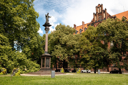 Wroclaw, Poland - July 10, 2026: Historic religious monument stands among lawns and mature trees in the Ostrow Tumski cathedral district.