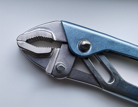 locking vice grip pliers macro on clean white surface