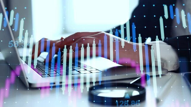A person is working on a laptop in an office. Financial charts and data are shown on the screen. The office is well-lit. The activity is focused on data analysis.