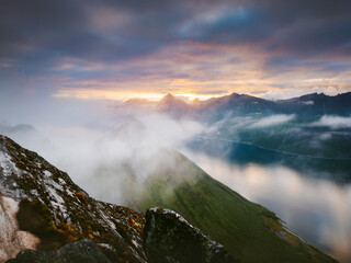 Senja aerial view in northern Norway foggy mountains and fjord landscape peaceful scenery, Arctic wild nature summer season midnight sun travel destinations beautiful places in Scandinavia © EVERST