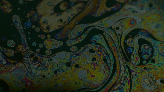 Psychedelic chemical ink. Soap oil swirl. Colorful liquid chaotic motion chemical blur texture. Mix drop water emulsion abstract background.