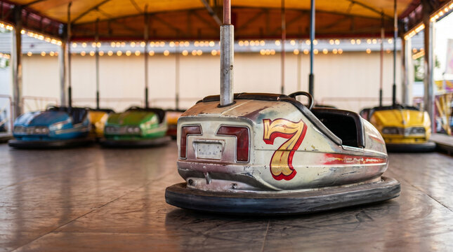 Bumper car number 7 in amusement park with colorful cars in background  