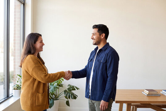 Peer mentor greeting a newcomer at a bright resource center