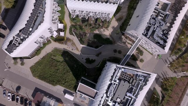 Aerial drone shot of modern medical complex rooftop ventilation HVAC equipment representing healthcare facility management and engineering