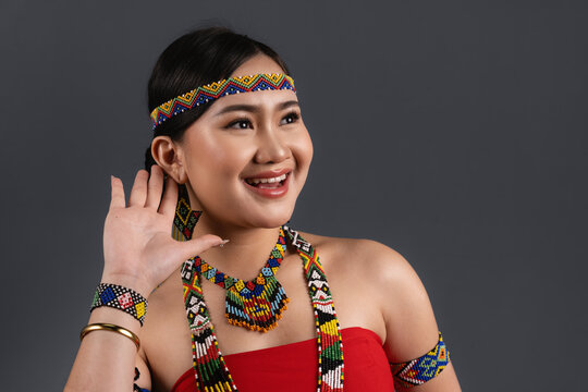 Young Sabahan Woman Wearing Traditional Murut Tahol Simba Costume Looking Aside