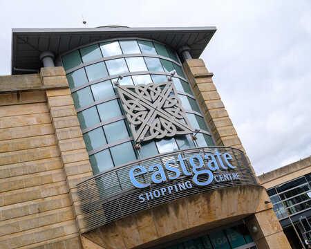 Eastgate Shopping Centre exterior facade and entrance in Inverness located in the Highlands of Scotland during a bright and cloudy daytime setting