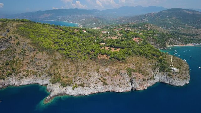Capo Palinuro Cilento Italy aerial drone flyover headland cape lighthouse tower rugged coastline sea bay panoramic view iconic cape 4k cinematic video