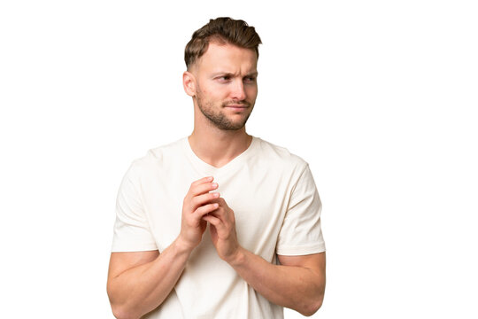 Young blonde caucasian man over isolated background scheming something