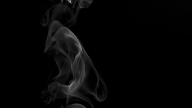 Slow Cigar Smoke Twirls. Slow White smoke rises lazily on a black background