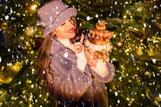 happy girl near a decorated New Year's tree