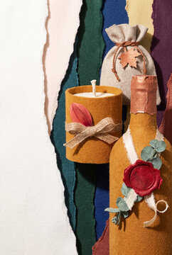 Autumn-themed wedding favors with candles and decorative elements  