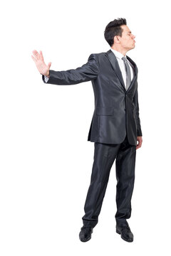 Funny male entrepreneur in suit showing stop gesture and expressing anger on transparent background