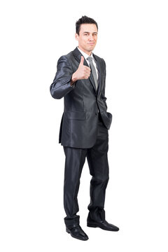 Optimistic male manager in formal suit showing approve sign and looking at camera against transparent background