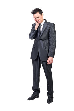 Hilarious male manager in classy suit crying and expressing sadness while touching face on transparent background