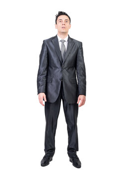 Full body of astonished male entrepreneur in formal suit looking forward with opened mouth on transparent background