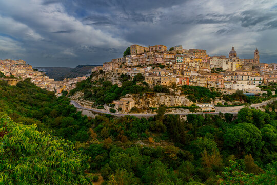 Ancient Italian hill town settlement with historic architecture and lush green surroundings epic dramatic travel destination site