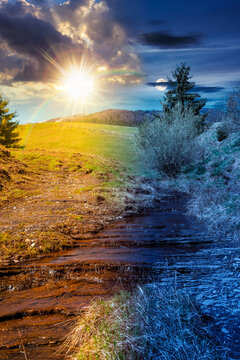 day meet night. rural scenery in carpathian mountains. sun and moon over simple view of a countryside mountain landscape during springtime at twilight. brook near the grassy hills. harmony concept