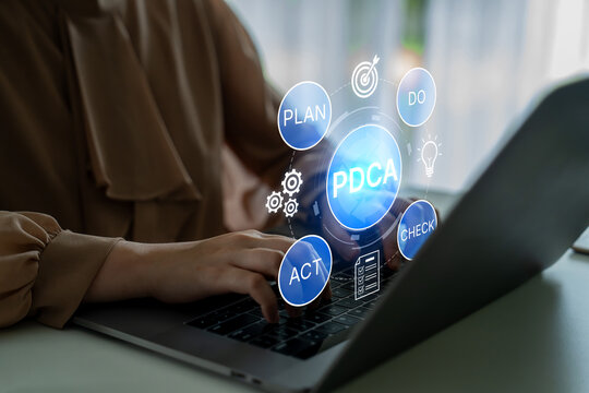 Business Professional Using Laptop to Implement PDCA Methodology for Continuous Improvement and Effective Project Management Strategies. Bitwise.