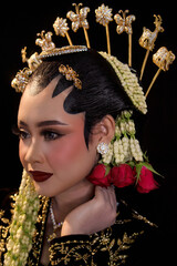 Javanese Bride Profile Portrait on Dark Background © Saddha Visual