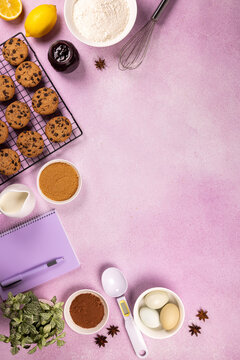 Baking chocolate chip cookies with ingredients on pink background