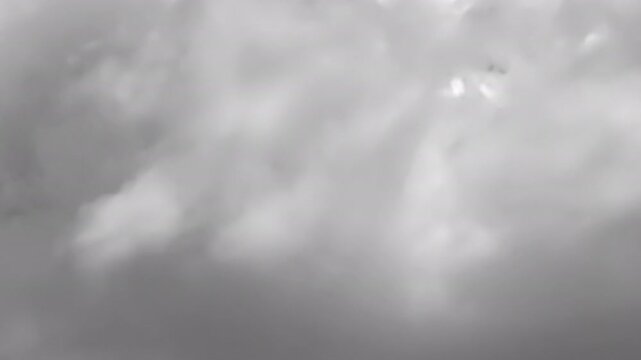Cinematic cloud transition with dense white clouds moving smoothly from left to right, covering the frame and revealing the background. Transparent alpha channel.