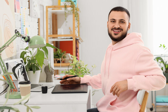 Male interior designer working in office