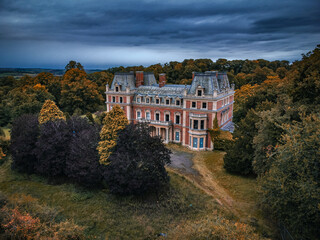 Obraz premium East Carlton Hall, a historic red-brick mansion located within East Carlton Countryside Park near Corby, Northamptonshire