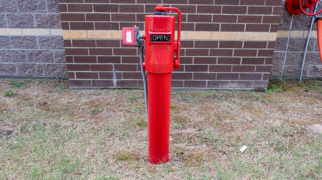 Red Post Indicator Valve PIV Exterior Fire Protection Control Unit Ground Level Commercial Building
