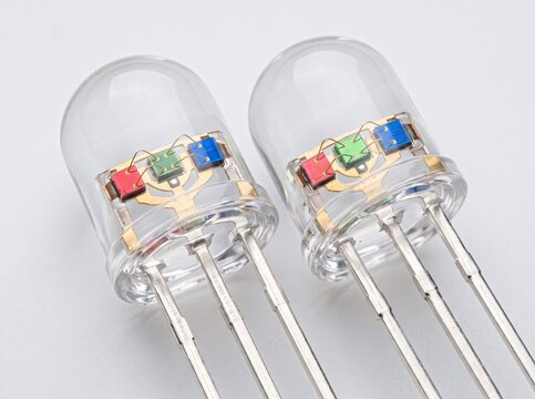 Two three color leds with exposed diodes ready for electronic projects.