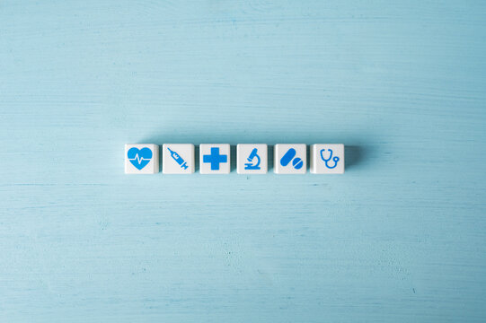 Healthcare and medical services concept with medical symbol cubes in a row
