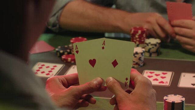 Casino player, Game of poker in casino, taking place with poker chips and cards on a green table betting chips, gambling place, roulette jack pot. All in bet game. 