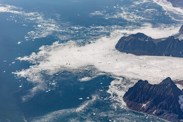 Sea ice surrounding mountains on the Greenland coast © Thomas
