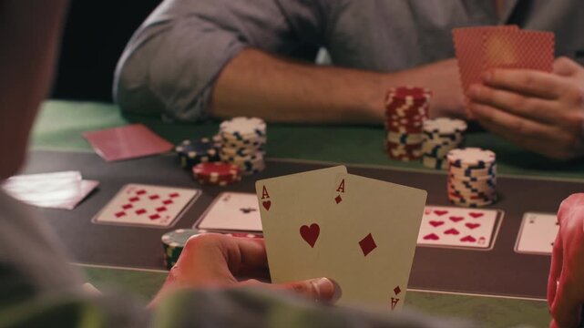 Casino player, Game of poker in casino, taking place with poker chips and cards on a green table betting chips, gambling place, roulette jack pot. All in bet game. 